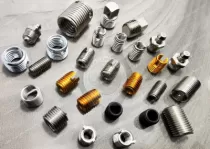 What is the role of the steel helical inserts?